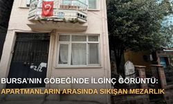 Bursa’nın göbeğinde ilginç görüntü: Apartmanların arasında sıkışan mezarlık